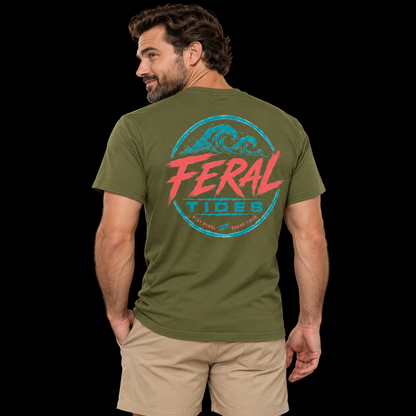 Male model wearing the Military Green Feral Tides Tidal Rebel Tee, looking back over left shoulder with one hand in pocket, showing the large coral-and-teal wave graphic on the back against a solid black background.